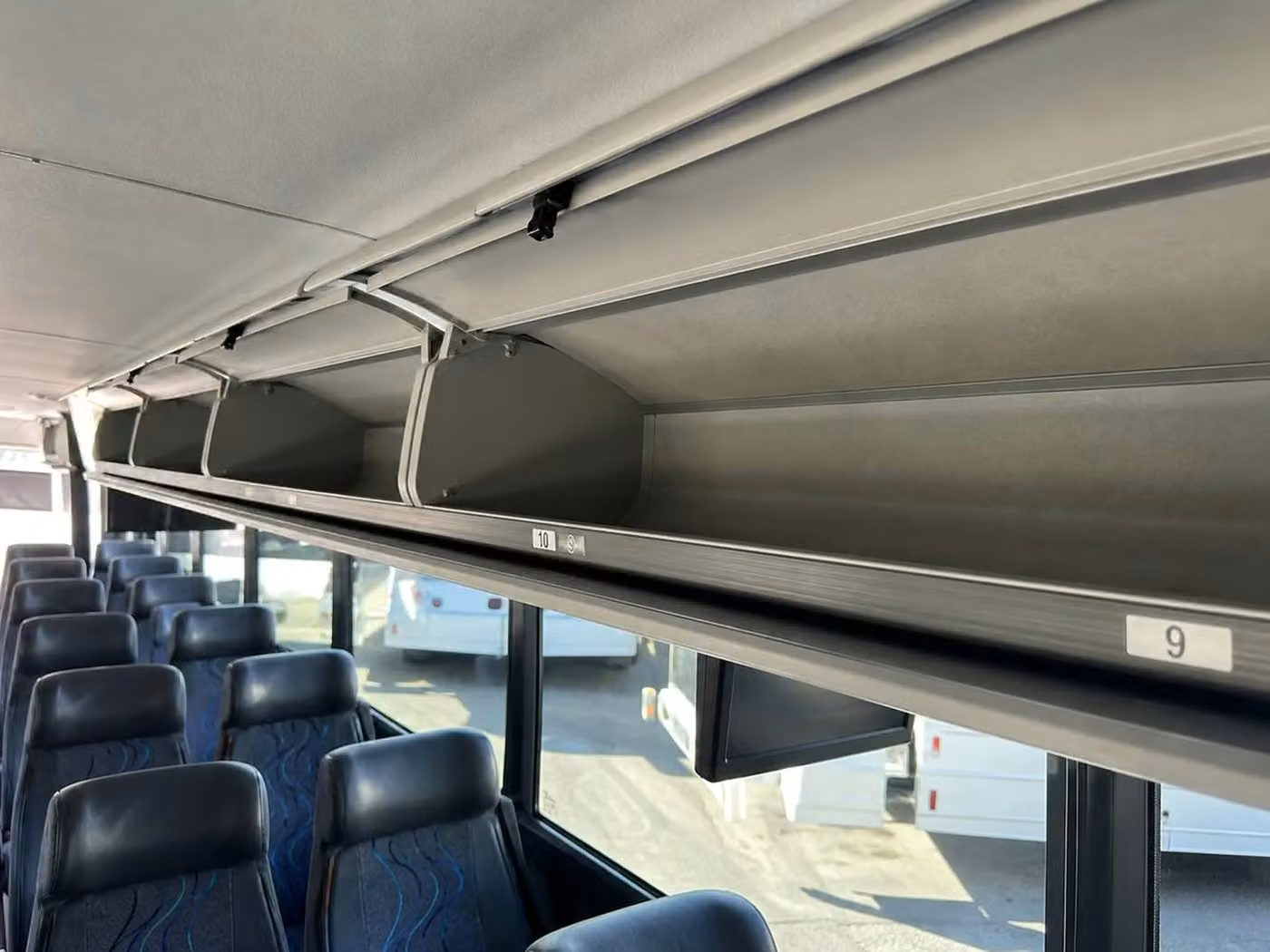dunedin 56 passenger charter bus overhead storage