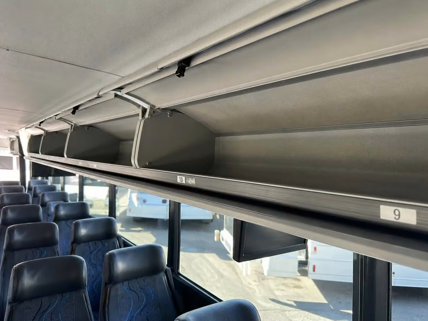 dunedin charter bus overhead storage